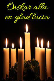 Ljus och stjärnor i mörkret för en glad lucia.